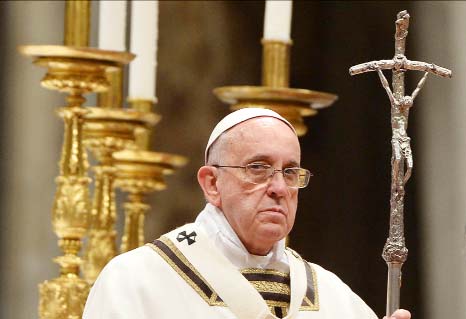 Pope Francis leads a Christmas Eve mass at St Peter's Basilica on Wednesday at the Vatican.