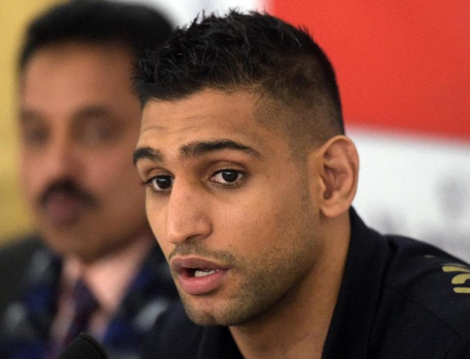 British boxer Amir Khan addresses media during a press conference in Islamabad on Wednesday.