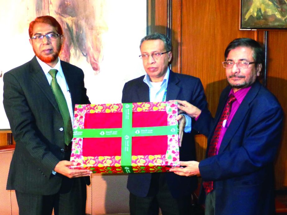 AFM Asaduzzaman, General Manager of Bangladesh Bank receiving 10 thousand warm clothes (on behalf of BB Governor) from Abdus Sadeque Bhuiyan, Executive Vice President and Head of Development Wing of Islami Bank Bangladesh Limited recently to distribute am