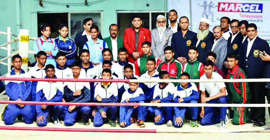 The winners of the Marcel TV Victory Day Boxing Competition with the guests and the officials of Bangladesh Boxing Federation pose for a photograph at the Muhammad Ali Boxing Stadium on Friday.