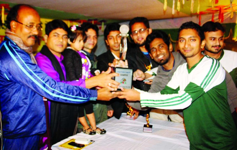 Assistant-Secretary of Central Sub-Committee of Bangladesh Awami League Hasibur Rahman Manik handing over the trophy to Azimpur Boys Club, which emerged the champions of the Azimpur Premier Cricket League at the Azimpur Boys Club Ground in the city on Fri