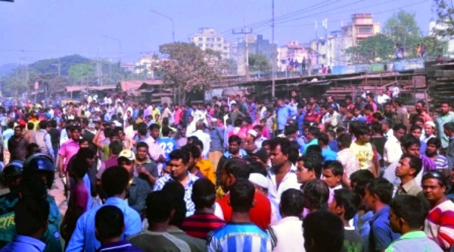 Owners and workers of the scrap iron and iron pipe manufacturing factories blocked road at Madarbari area under Sadarghat thana protesting detention of workers yesterday.