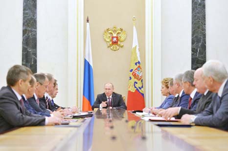 Russian President Vladimir Putin, centre, heads the Security Council in Moscow's Kremlin, Russia on Friday.