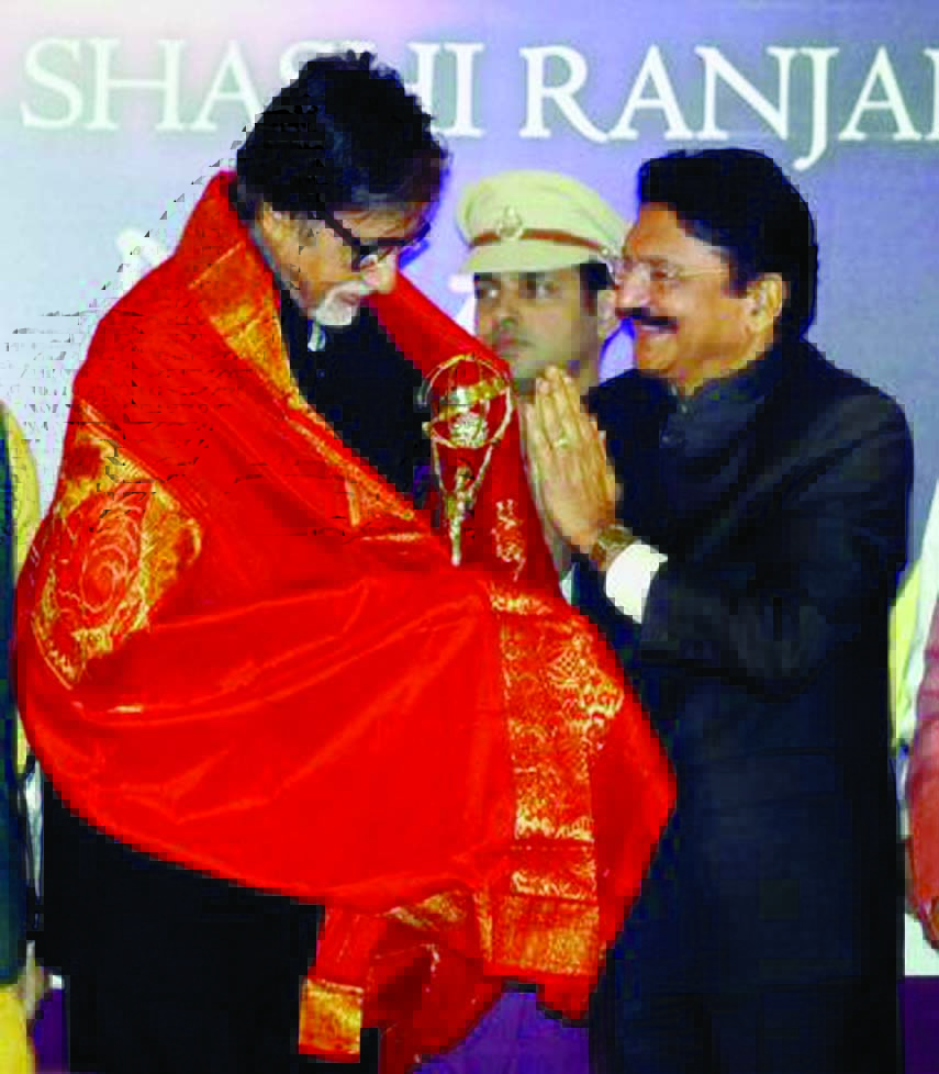 Amitabh Bachchan being given the second Yash Chopra Memorial Award by the Governor of Maharashtra C. Vidyasagar Rao in Mumbai on Thursday.