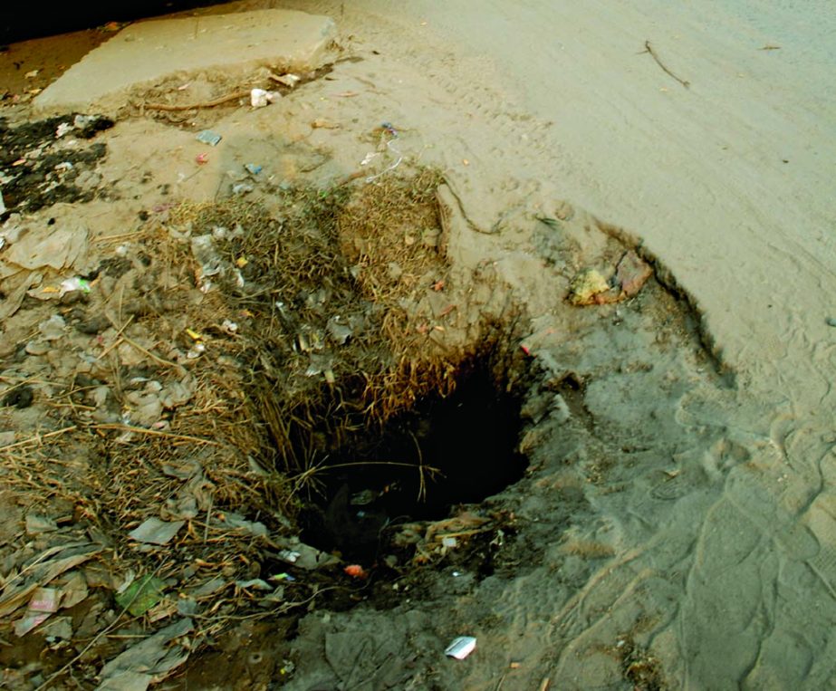 DEATH TRAP! There are huge uncovered manholes seen in the capital as DCC authorities don't care to look after the problems. This photo was taken from in front of Shyampur thana on Saturday. Photo: Sharif Khan