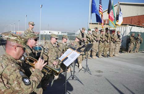The International Security Assistance Forces band plays during flag-lowering ceremony in Kabul, Afghanistan .
