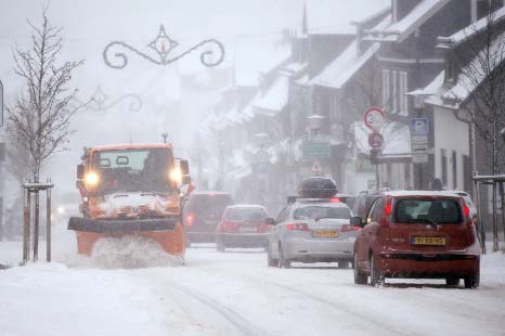 Snow-plough clears the street in Winterberg, western Germany on Saturday. Weather forecasts predict more snowfall.