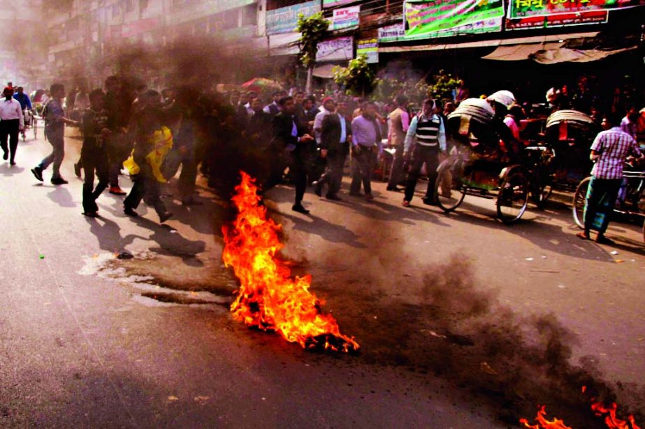 Hartal supporters staged demonstration setting fire on the street on Sunday. This photo was taken from city's Fakirerpool area.