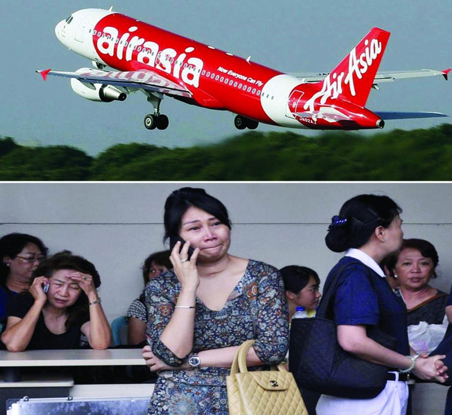 Weeping relatives await news of the Air Asia missing plane at Juanda Airport, Surabaya, Indonesia on Sunday . Internet photo