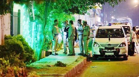 Police officials on spot where a low intensity bomb blast occurred at Church Street in Bengaluru on Sunday night