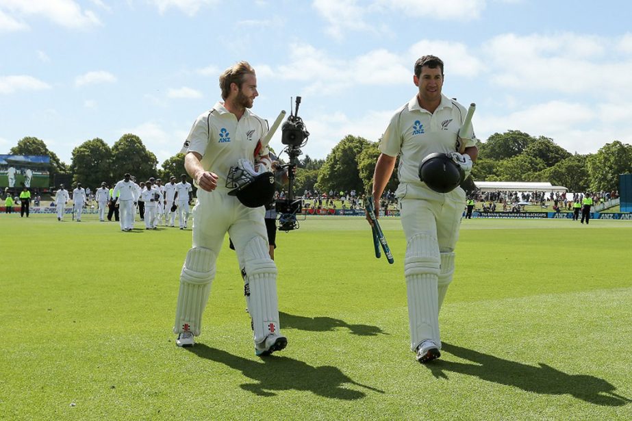 Kane Williamson and Ross Taylor walk back after claiming victory during day four of the First Test match between New Zealand and Sri Lanka at Hagley Oval on Monday.