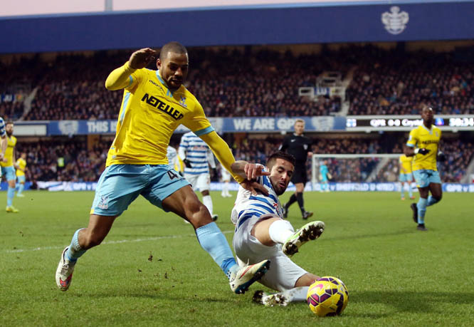 Crystal Palace's Jason Puncheon (left) battles for the ball with Queens Park Rangers' Mauricio Isla during the Barclays Premier League match at Loftus Road, London on Sunday.