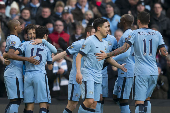 Manchester City's David Silva (second left) celebrates with teammates after scoring against Burnley during the English Premier League soccer match between Manchester City and Burnley at the Etihad Stadium, Manchester, England on Sunday.
