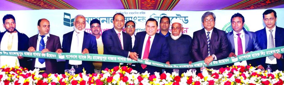 Shamsul Huda Khan, Managing Director of National Bank Limited, inaugurating Rajendrapur Bazar branch of the bank at South Keraniganj in Dhaka on Tuesday. Keraniganj Upazila Chairman Shahin Ahmed presided.