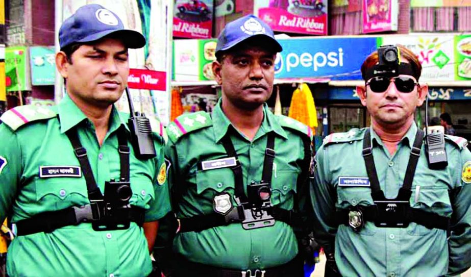 Traffic sergeants started to carry audio-video cameras for taking instant snap of violating traffic rules. This photo was taken from Shahbag area on Wednesday.