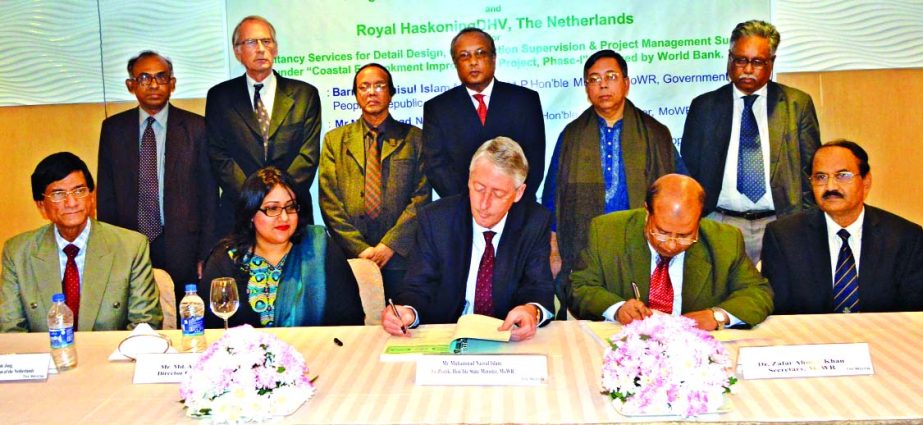 Sarafat Hossain Khan of BWDB and Roelof Mall of Royal Haskoning DHV signing a contract for the World Bank financed project, "Consultancy Services for Detail Design, Construction Supervision & Project Management Support under 'Coastal Embankment Improve