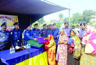 DINAJPUR(South):Dinajpur Police Administration distributing blankets among cold- hit people in Dinajpur town on Tuesday.