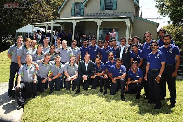 Players from both sides posed for the official photo session with Abbott at Kirribilli House, his second official residence on Thursday.