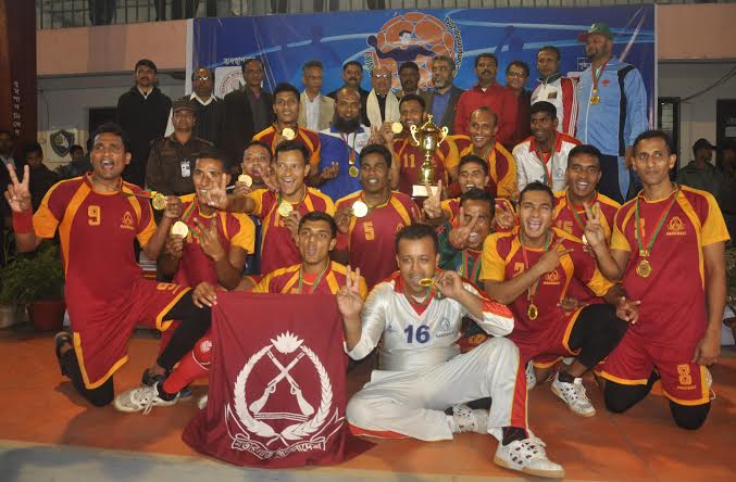 BGB, the champions of the EXIM Bank 24th Men's Handball Championship with the guests and the officials of Bangladesh Handball Federation pose for a photo session at the Shaheed (Captain) M Mansur Ali National Handball Stadium on Thursday.