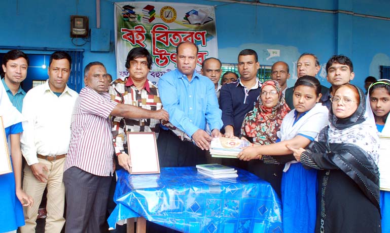 Students receiving free textbooks at Fatehpur High School in Chittagong on Thursday.