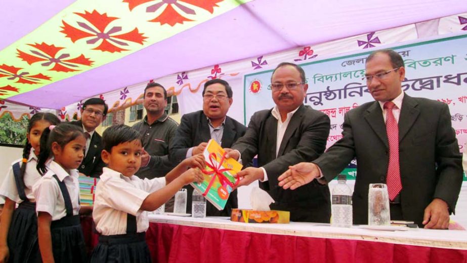 Kugendro Lal Tripura, MP, Khagrachhari distributing free textbooks at Khagrachhari Model Govt Pry School on Thursday.