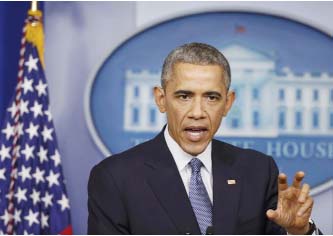 US President Barack Obama answers a question about the cyberattack on Sony Pictures after his end of the year press conference in the briefing room of the White House in Washington