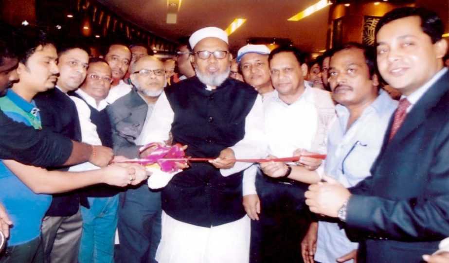 Former City Mayor ABM Mohiuddin Chowdhury seen cutting ribbon at the inaugural ceremony of Tower-Inn Bakery & Sweets at hotel premises as chief guest on Thursday.