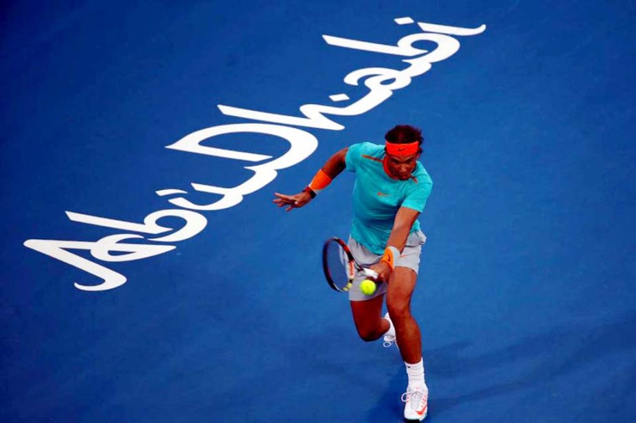 Spanish tennis player Rafael Nadal returns the ball to Scottish player Andy Murray during their semi-final tennis match in the Mubadala World Tennis Championship in Abu Dhabi on Friday.