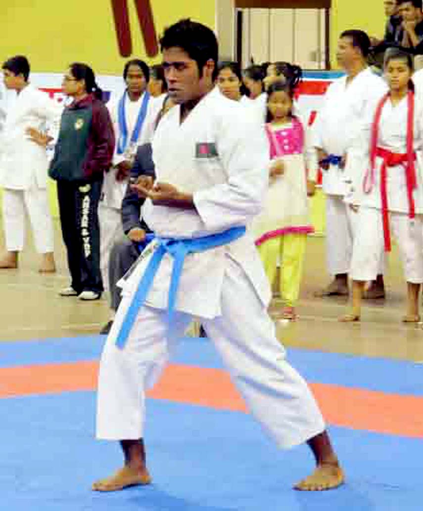 Hasan Khan of Bangladesh Ansar showing performance during Men's Individual Kata of 23rd National Karate Competition at the Shaheed Suhrawardy Indoor Stadium in Mirpur on Saturday. He won gold medal in that event.