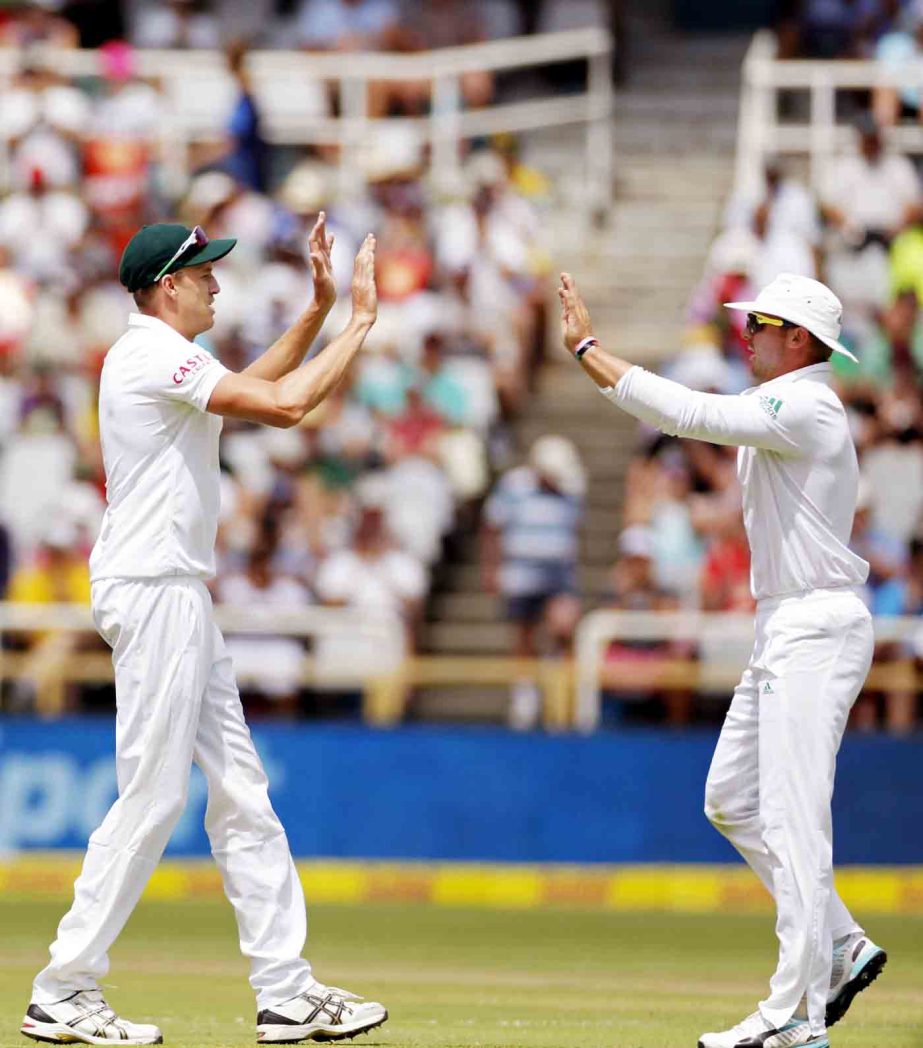 South Africa's Morne Morkel (left) celebrates with a teammate after they took the wicket of West Indies' Jason Holder during their third Test cricket match in Cape Town, South Africa on Saturday.