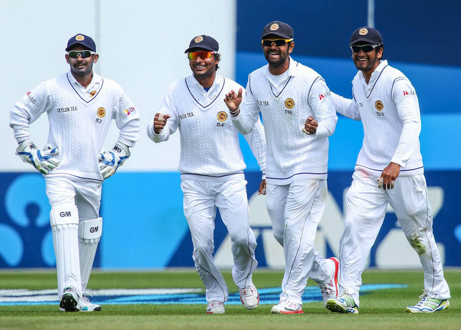 (L to R) Prasanna Jayawardene, Kumar Sangakkara, Lahiru Thirimanne and Dimuth Karunaratne of Sri Lanka celebrate the wicket of James Neesham of New Zealand during day three of the Second Test match between New Zealand and Sri Lanka at Basin Reserve on Mon