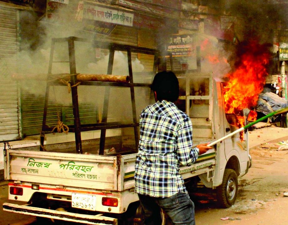 An auto-van was burnt by BNP supporters at Kuril in city on Monday.
