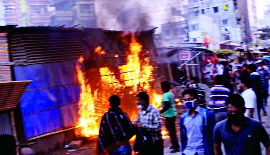 Pro-BNP supporters set on fire to Sramik League Office at city's Dania 5 No Ward on Monday.