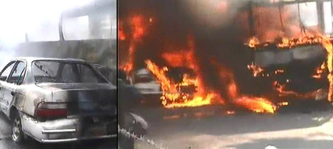 A private car and a state-run BRTC bus burning near Rajuk Bhaban at Gulistan on Tuesday