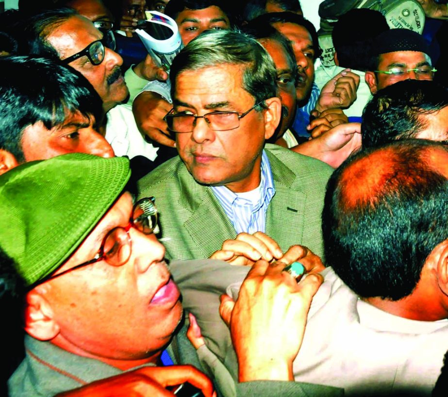 BNP's Acting Secretary General Mirza Fakhrul Islam Alamgir, who was picked up by DB police from Jatiya Press Club on Tuesday is being taken to its headquarters in city on Tuesday.