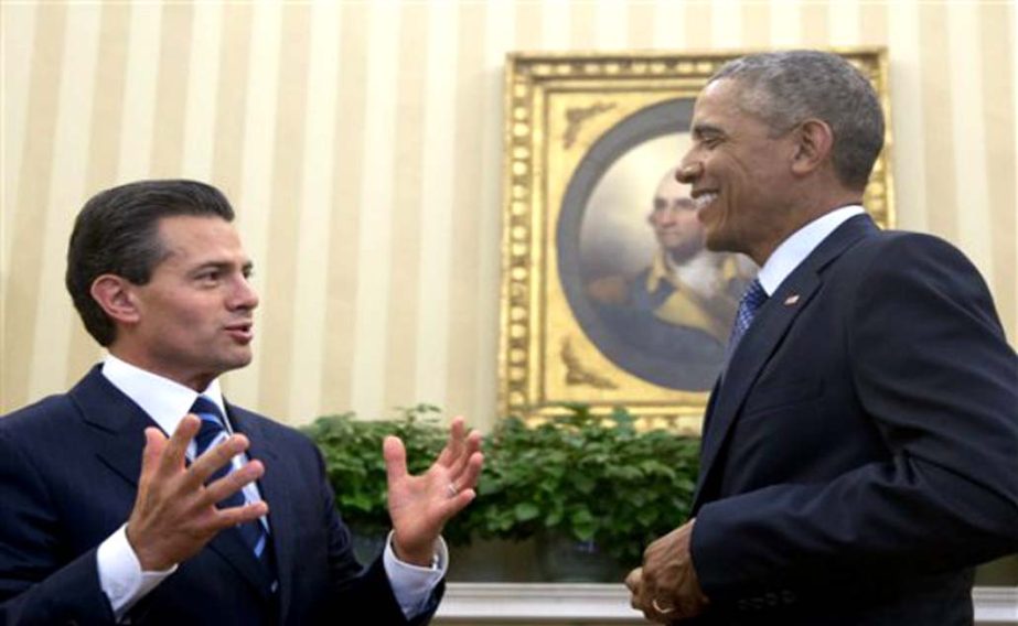 US President Barack Obama hosts a bilateral meeting with Mexican President Enrique Pena Nieto in the Oval Office of the White House in Washington.