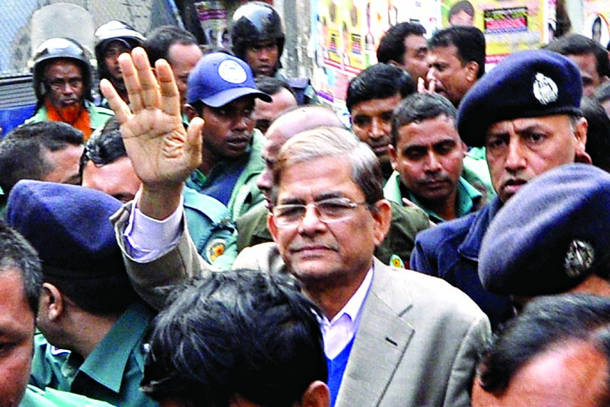 BNP Secretary General Mirza Fakhrul Islam Alamgir being taken to CMM Court by DB police on Wednesday.