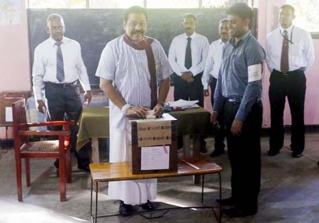 Sri Lanka's President Mahinda Rajapaksa casts his vote for the presidential election, in Medamulana on Thursday.