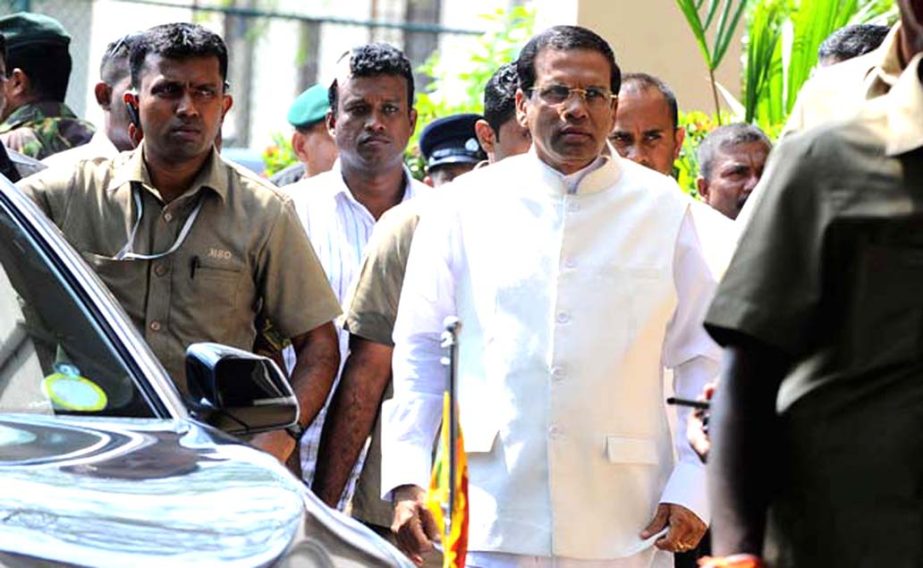Sri Lanka's newly elected president Maithripala Sirisena arrives at the Election Commission office in Colombo on Friday.