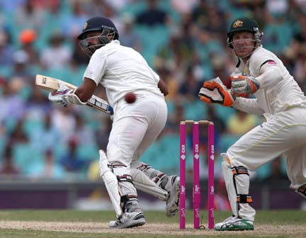 India's Murali Vijay (left) watches the ball run down leg past Australia's Brad Haddin (right) on the fifth day of their cricket Test match in Sydney on Saturday.