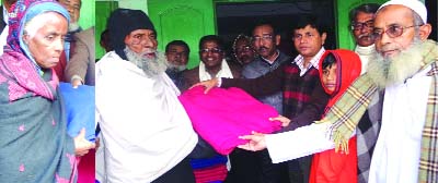 NETRAKONA: Dr Torun Kanti Shikder, DC, Netrakona distributing blankets among the poor freedom fighters on Wednesday. Nurul Amin, Commander of the district Muktijuddah Sangsad and other freedom fighters were present on the occasition.