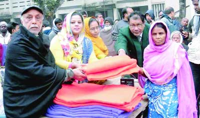 NILPHAMARI: Sarkar Farhana Akter Sumi, President, Muktijuddah Sangsad Projunmo Command, Rajshahi University Unit distributing blankets among cold-hit people at Chilmari Govt College premises recently.