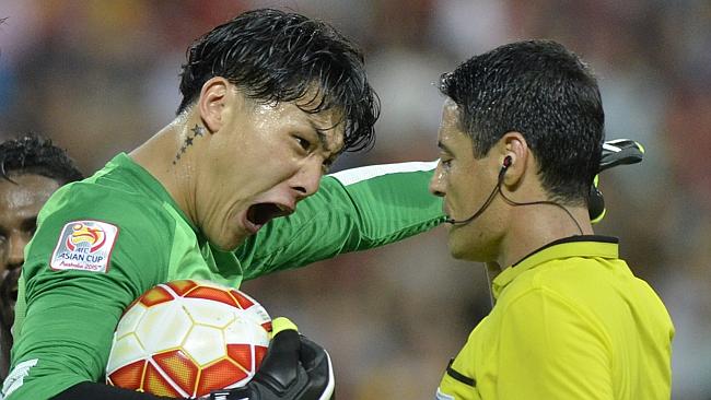 China goalkeeper Zeng Cheng reacts to a penalty awarded to Saudi Arabia.