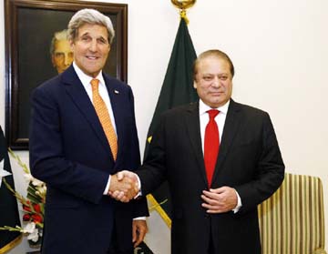 US Secretary of State John Kerry (L) shaking hands with Pakistan Prime Minister Nawaz Sharif shortly after arriving in Islamabad on Monday .