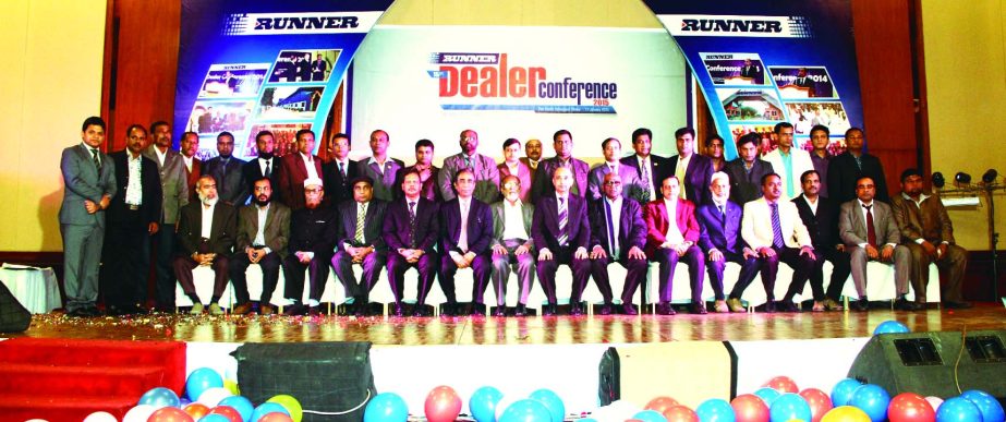 Hafizur Rahman Khan, Chairman of Runner Auto Mobiles Limited, poses with its dealers at a "Dealers' Conference" in a city hotel on Monday.