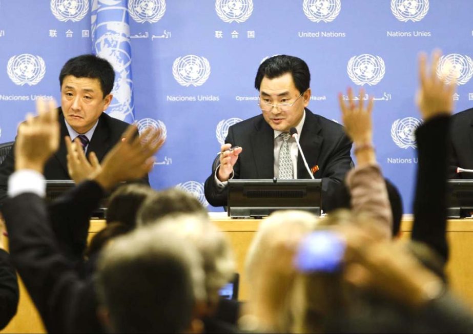 An Myong Hun, center, Deputy Permanent Representative for North Korea responds to questions during a news conference on Tuesday at the UN headquarters.