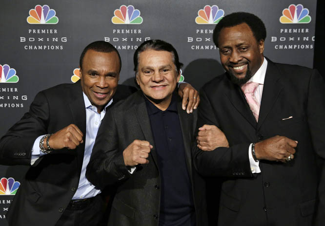 Boxing greats, from left, Sugar Ray Leonard, Roberto Duran and Thomas Hearns joke around while posing for pictures during a news conference in New York on Wednesday. NBC plans to air boxing matches on broadcast television beginning with an event on March