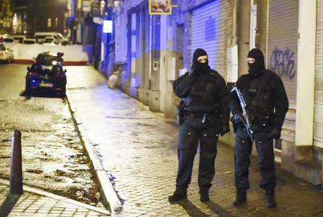 Police stand guard in Verviers on Thursday after two Jihadists were reportedly killed during an anti-terrorist operation.