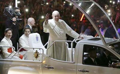 Pope Francis waves to Filipinos as he arrives in Manila, Philippines.