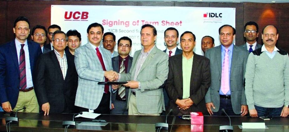 Muhammed Ali, Managing Director of United Commercial Bank Limited and Selim RF Hussain, Managing Director of IDLC Finance limited, sign a Term Sheet agreement on Thursday.